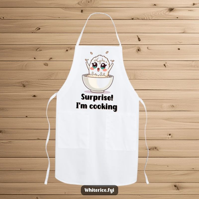 Funny rice apron shows a surprised grain of rice character leaping out of a bowl with wide eyes, a humorous and practical kitchen accessory.