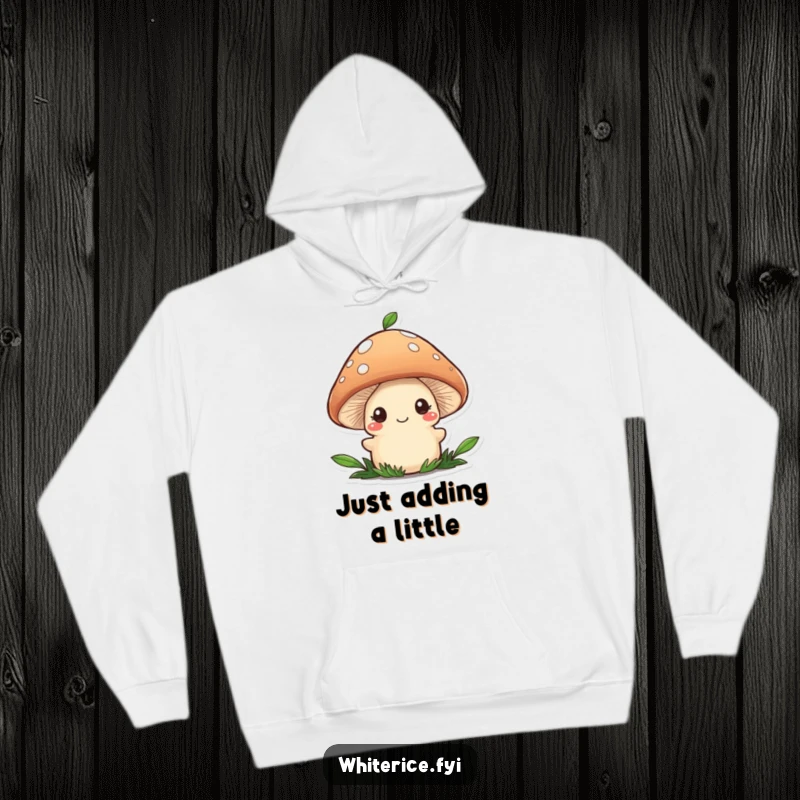 Funny hoodie with a wobbly brown mushroom character shyly smiling, adding a final flourish of garnish to food.