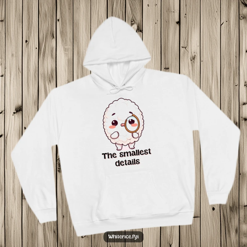 Funny rice character hoodie, peering intently through a tiny magnifying glass, exuding curiosity and comfort.