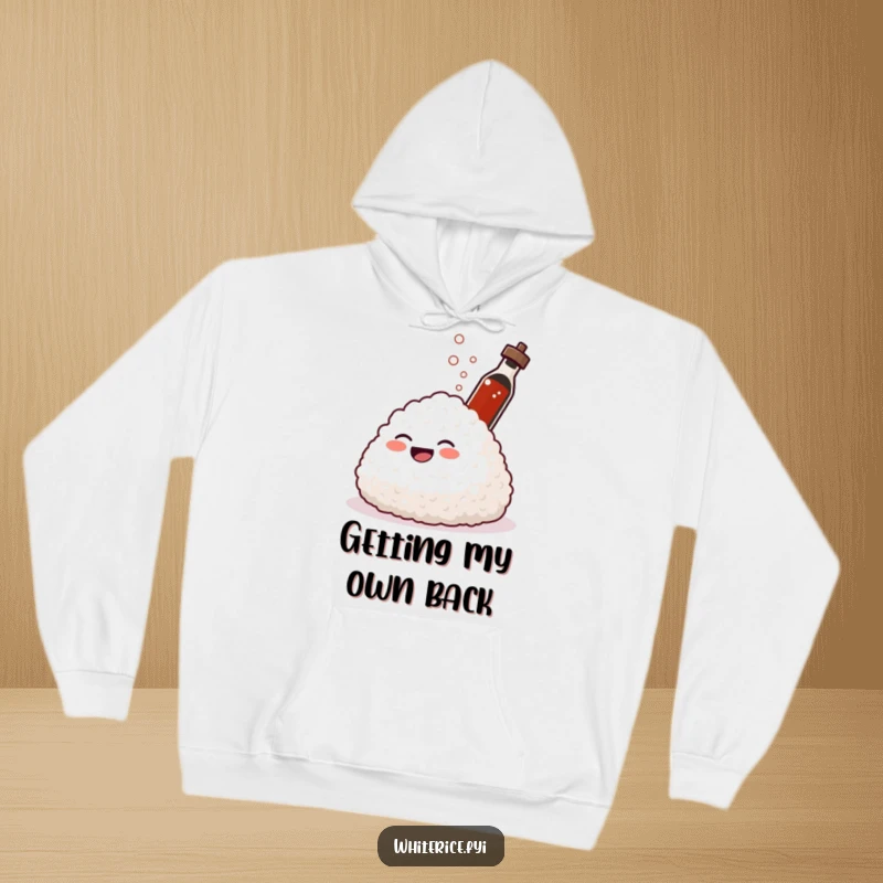 Funny hoodie showing a giggling mound of rice laughing while a soy sauce bottle sprays. Cozy and amusing.