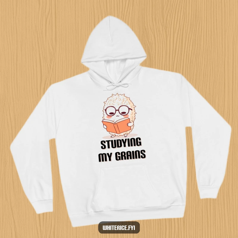 Funny rice hoodie features a bewildered ball of rice wearing glasses, deeply engrossed in a large book, ideal for cozy readers.